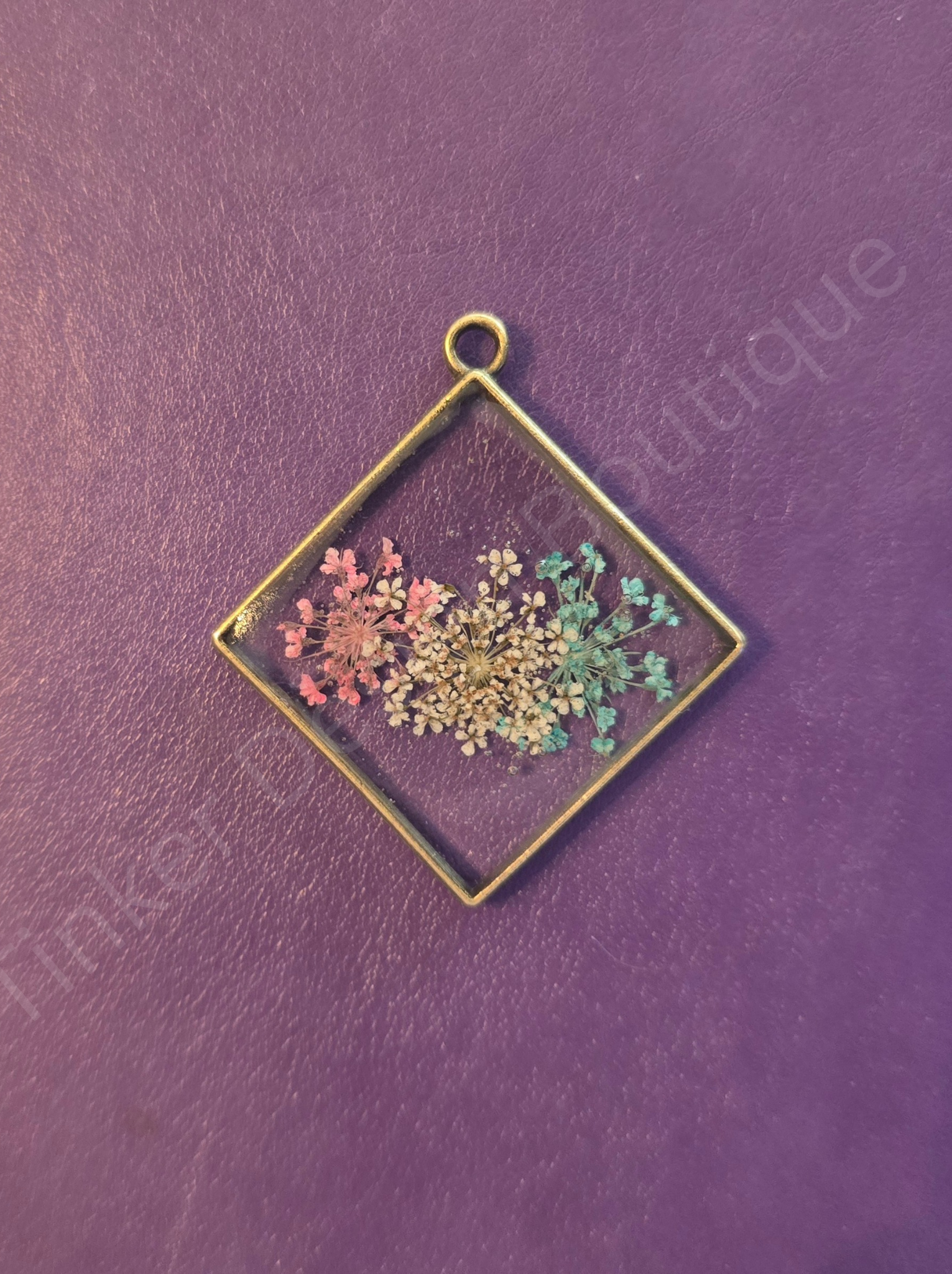 Pink, white, and blue flower necklace